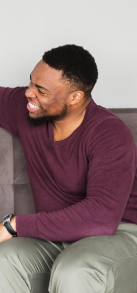 a man and a woman talking on a couch